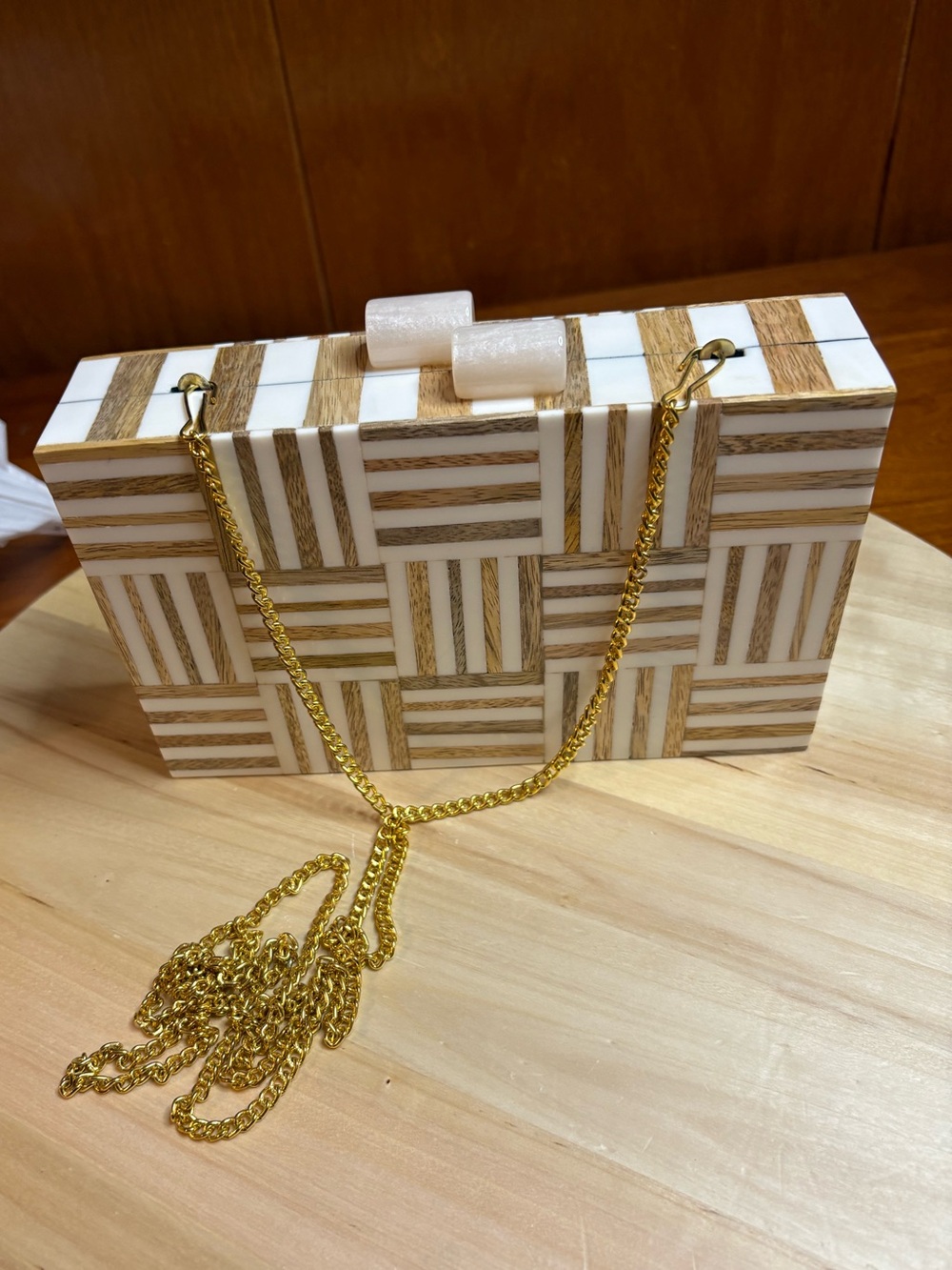 geometric wood-and-resin inlay hard-case clutch with a gold-tone chain strap